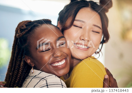 Happy, smile and lesbian couple hugging with love, care and excitement together in the living room. Happiness, pride and interracial young lgbtq women bonding for affection moment in modern apartment Happy, smile and lesbian couple hugging with love, care and excitement together in the living room. Happiness, pride and interracial young lgbtq women bonding for affection moment in modern apartment 137418443
