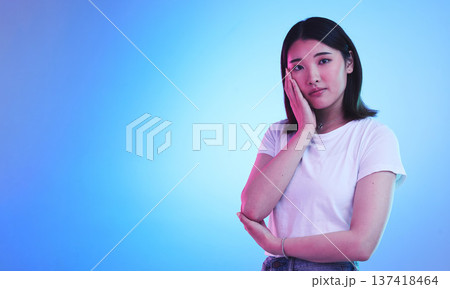 Mockup, neon and portrait of Asian woman in studio for information, promotion and deal on blue background. Creative lighting, marketing and isolated person with space for news, announcement and sale 137418464
