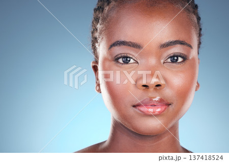 Black woman, beauty and portrait with cosmetics, makeup and dermatology treatment. Studio, model face and African female person with skincare, facial and blue background with skin glow and care 137418524