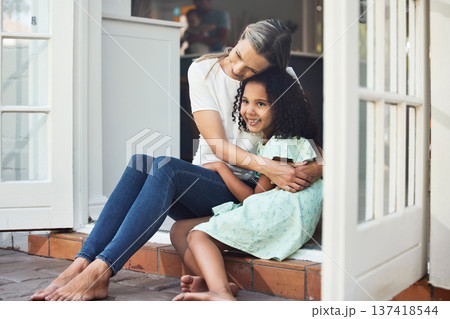 Adoption, mom and child together for hug, support or love in family home of girl in foster care with a smile of happiness. Interracial, mother and daughter bonding in embrace or playing outdoor Adoption, mom and child together for hug, support or love in family home of girl in foster care with a smile of happiness. Interracial, mother and daughter bonding in embrace or playing outdoor 137418544