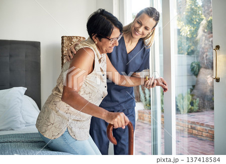 Happy woman, nurse and senior in elderly care, support or walking with stick at old age home. Medical caregiver or therapist helping patient or person with a disability in retirement or physiotherapy 137418584
