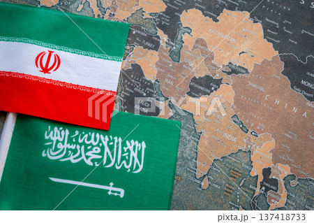 National flag of Iran and Saudi Arabia on the world map background. Iran and USA war. Crisis and terrorism. National flag of Iran and Saudi Arabia on the world map background. Iran and USA war. Crisis and terrorism. 137418733