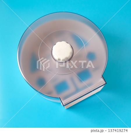 jumbo toilet roll dispenser made of plastc in a round shape. 137419274