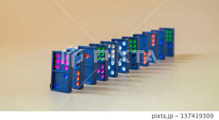 Dominoes game on a color background.Selective focus. 137419309