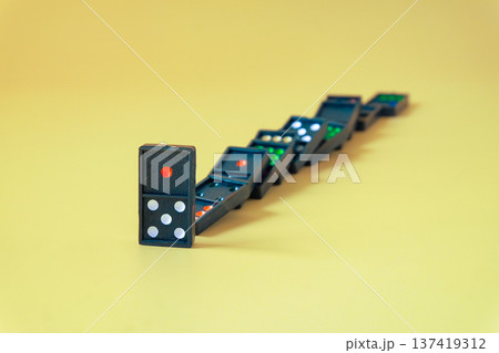 Dominoes game on a color background.Selective focus. Dominoes game on a color background.Selective focus. 137419312