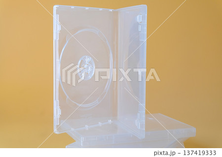 Blank CD case or CD cover on color background. 137419333