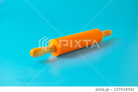 New plastic rolling pin isolated on white background. New plastic rolling pin isolated on white background. 137419342