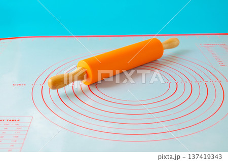New plastic rolling pin isolated on white background. New plastic rolling pin isolated on white background. 137419343