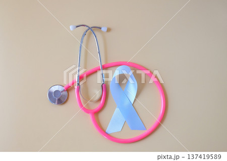 Blue ribbon and stethoscope on color background. 137419589