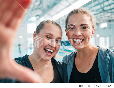 Selfie, swimming pool and portrait of women athletes after exercise, workout or training. Happy, smile and headshot of young girl friends taking a picture after fitness or sports competition together Selfie, swimming pool and portrait of women athletes after exercise, workout or training. Happy, smile and headshot of young girl friends taking a picture after fitness or sports competition together 137420832