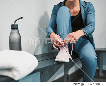 Fitness, tie shoes and sport woman in gym locker room for exercise, workout, healthy lifestyle and wellness. Person and shoelaces in sportswear for training, cardio and strong muscle for competition 137420837