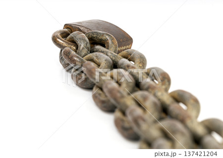 Close-Up Macro of a Rusted, Weathered Chain with Heavy Metallic Padlock on Isolated White Background Portraying Strength and Security Concepts Close-Up Macro of a Rusted, Weathered Chain with Heavy Metallic Padlock on Isolated White Background Portraying Strength and Security Concepts 137421204