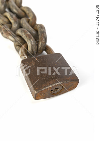 Close-Up of a Weathered and Rusted Old Chain with a Heavy Iron locked Padlock on White Background 137421208