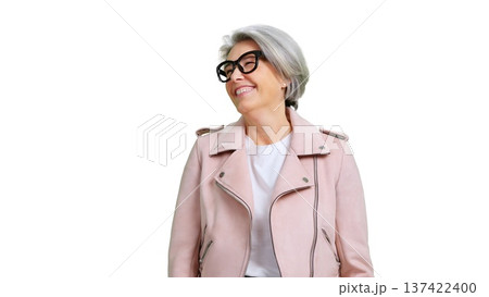 Mature woman smiling wearing pink jacket and glasses 137422400