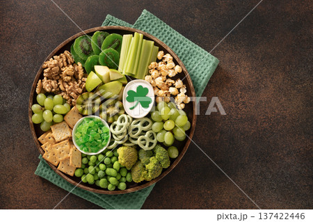 Green snack platter for St Patrick day celebration top view Green snack platter for St Patrick day celebration top view 137422446