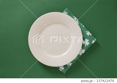 Empty white plate on green St Patricks day background 137422478