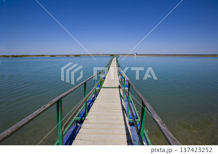 Minimal Wooden Pier Over Water With Open Sky Minimal Wooden Pier Over Water With Open Sky 137423252