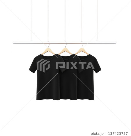 Three black t shirts hang on wooden hangers from minimalist white rod, creating sleek and modern display. simplicity and elegance of arrangement highlight shirts design 137423737