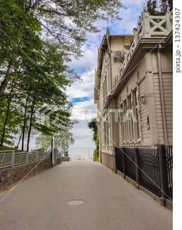 A summer street scene in Jurmala. Bright sunny mood and resort town energy. A summer street scene in Jurmala. Bright sunny mood and resort town energy. 137424307