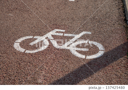 Image in the asphalt of a road with bike lane 137425480