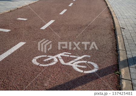 Image in the asphalt of a road with bike lane 137425481
