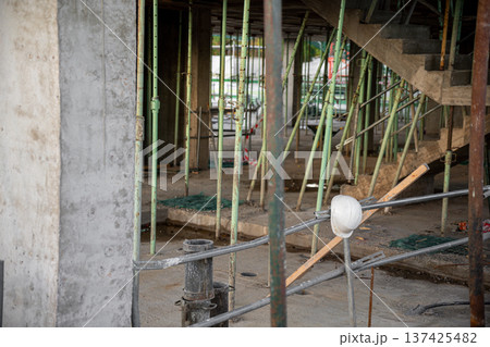Image of a white work helmet with construction and work area background 137425482