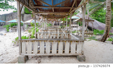 Rustic Wooden Beach Huts and Gazebos on Sandy Shore Rustic Wooden Beach Huts and Gazebos on Sandy Shore 137426074