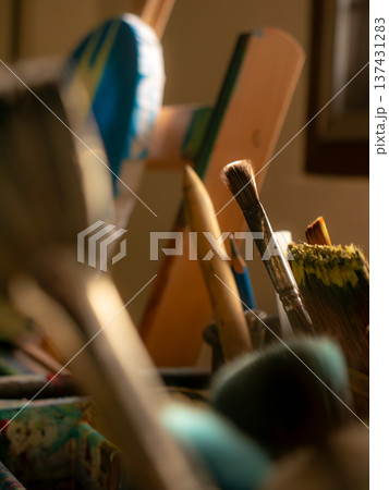 Closeup of Painting Tools Including Brushes Palette Knife and Canvas Closeup of Painting Tools Including Brushes Palette Knife and Canvas 137431283