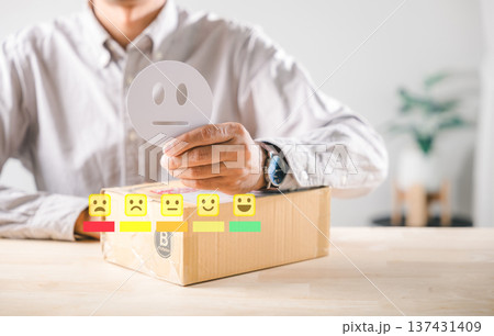 Feedback vital for customer experience, person holding neutral emoji above delivery box, evaluating online shopping service satisfaction, survey concept illustrates business reputation Feedback vital for customer experience, person holding neutral emoji above delivery box, evaluating online shopping service satisfaction, survey concept illustrates business reputation 137431409