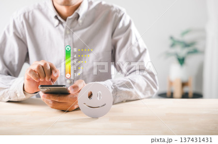 Customer provides positive feedback and rates online service 5 stars using smartphone for happy satisfaction concept, showing business client quality review evaluation Customer provides positive feedback and rates online service 5 stars using smartphone for happy satisfaction concept, showing business client quality review evaluation 137431431