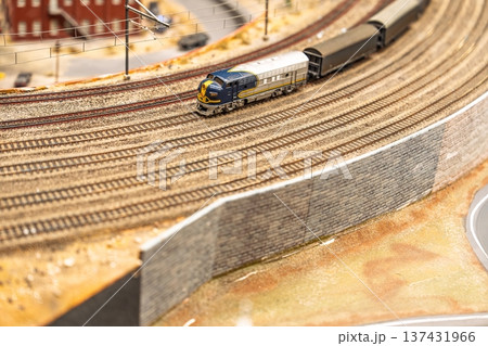 Miniature Railway Scene A Detailed Model Train Set on a Curving Track Display 137431966