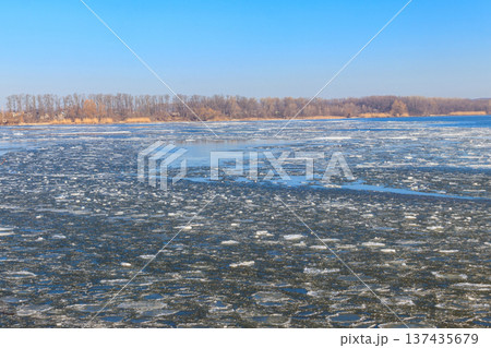 View of a lake with melting ice at spring View of a lake with melting ice at spring 137435679