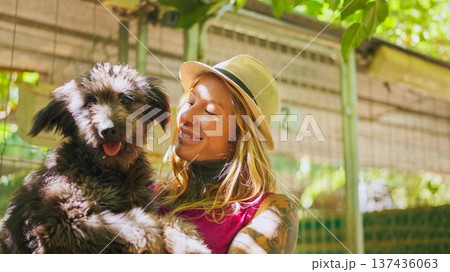 Young woman enjoying a tender moment with her dog Young woman enjoying a tender moment with her dog 137436063