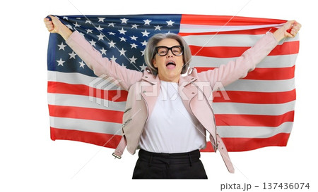 Senior woman celebrating American patriotism with United States flag Senior woman celebrating American patriotism with United States flag 137436074