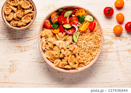 Bowl of quinoa with vegan soy meat and vegetables. 137436844