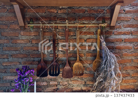 Vintage kitchen decoration with wooden tools and brick Vintage kitchen decoration with wooden tools and brick 137437433