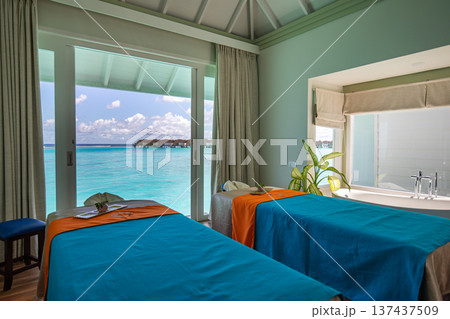 Luxury tropical resort spa beds overlooking turquoise ocean relaxing wellness retreat peaceful seaside travel destination summer vacation paradise Luxury tropical resort spa beds overlooking turquoise ocean relaxing wellness retreat peaceful seaside travel destination summer vacation paradise 137437509