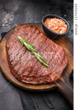 Grilled Flank Flap beef steak, showcasing beautiful grill marks. black background. top view 137438269