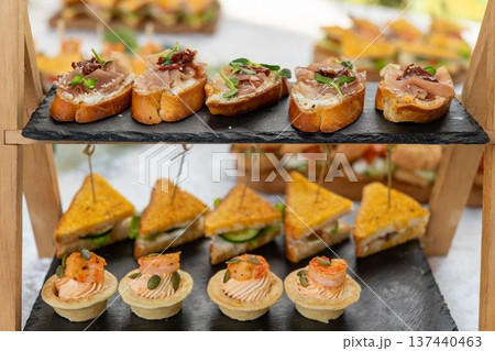 Elegant catering display with assorted snacks 137440463