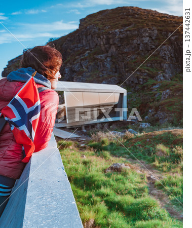 Andoya island sea coast and tourist with norwegian flag Andoya island sea coast and tourist with norwegian flag 137442631