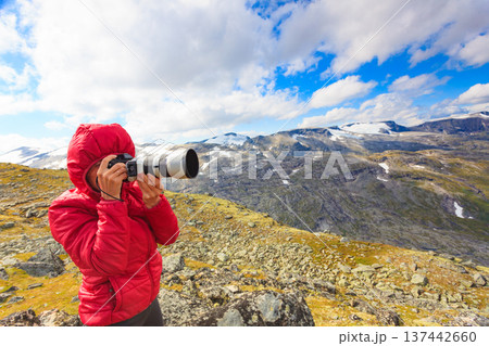 Tourist taking photo fin norwegian mountains 137442660