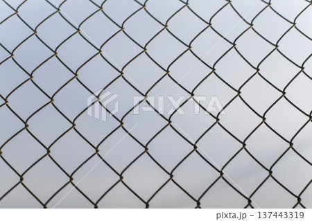 Metal chain link fence pattern background Metal chain link fence pattern background 137443319