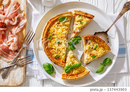 Quiche Lorraine on a white plate, top view 137443903