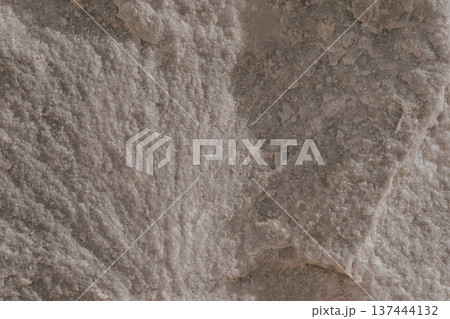 Natural Greek Mediterranean stone texture close-up. Warm beige limestone or ancient marble surface Natural Greek Mediterranean stone texture close-up. Warm beige limestone or ancient marble surface 137444132