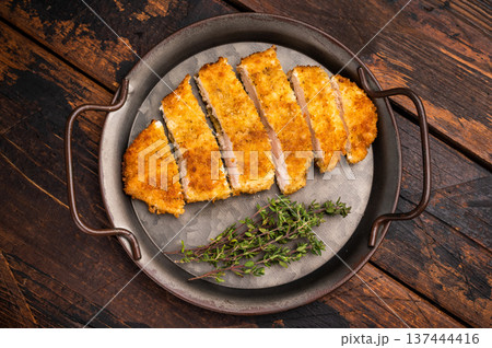 Katsu Golden fried cutlet. This Japanese favorite brings comfort and flavor to any table. wooden background. top view Katsu Golden fried cutlet. This Japanese favorite brings comfort and flavor to any table. wooden background. top view 137444416
