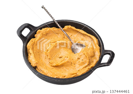Natural peanut butter spread in skillet close up. Creamy peanut paste made from roasted peanuts, healthy protein snack and cooking ingredient. 137444461