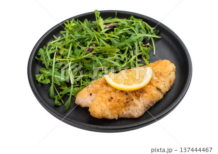 Pan fried red perch fish fillet served with fresh arugula salad and lemon on isolated background. Pan fried red perch fish fillet served with fresh arugula salad and lemon on isolated background. 137444467