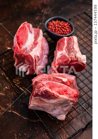 Thick Cut raw Beef Short Ribs, fresh meat with bone. brown background. top view Thick Cut raw Beef Short Ribs, fresh meat with bone. brown background. top view 137444599