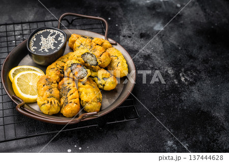 Crispy seaweed noodle rolls Gimmari, Korean deep fried seaweed rolls. black background. top view Crispy seaweed noodle rolls Gimmari, Korean deep fried seaweed rolls. black background. top view 137444628