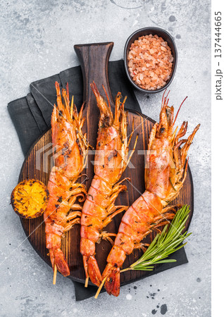 Seafood Skewers with Grilled red Argentine shrimps, Prawns Langostino Austral. grey background. top view Seafood Skewers with Grilled red Argentine shrimps, Prawns Langostino Austral. grey background. top view 137444665